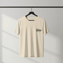 Beige t-shirt with 'Walk by Faith, Not by Sight' text on a hanger against a gray background